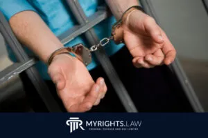 A person in handcuffs stands behind jail bars with their hands extended forward. The MyRights.Law logo and website information appear at the bottom, highlighting San Bernardino Sex Crime Lawyer services.