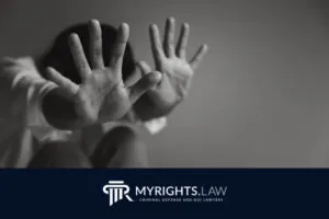 A person covers their face with both hands, palms facing forward. The image features the My Rights Law logo and text reading 