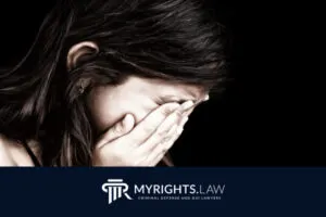 A person covers their face with both hands, appearing distressed. At the bottom, there is a logo and text for MYRIGHTS.LAW, Rancho Cucamonga CACI Removal Lawyer and criminal defense and DUI lawyers.